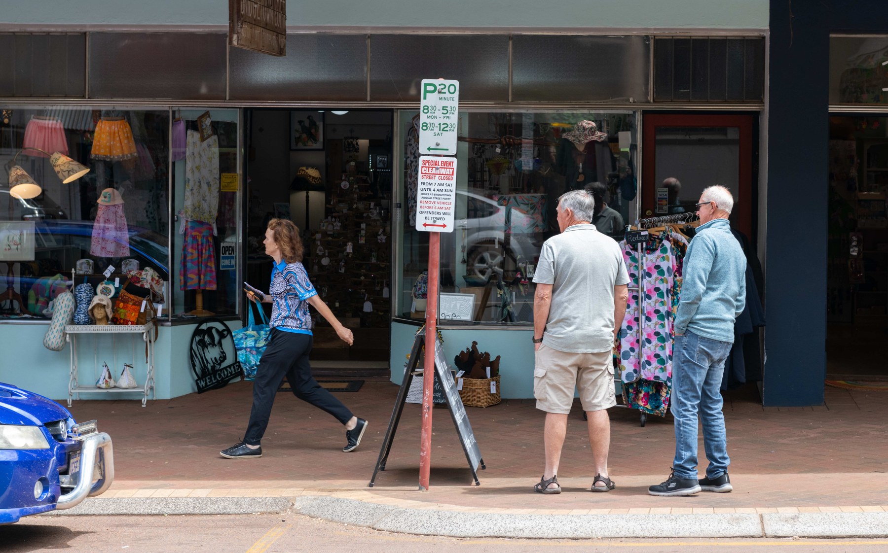 Festival visitors browsing boutique shops along Bridgetown’s main street.