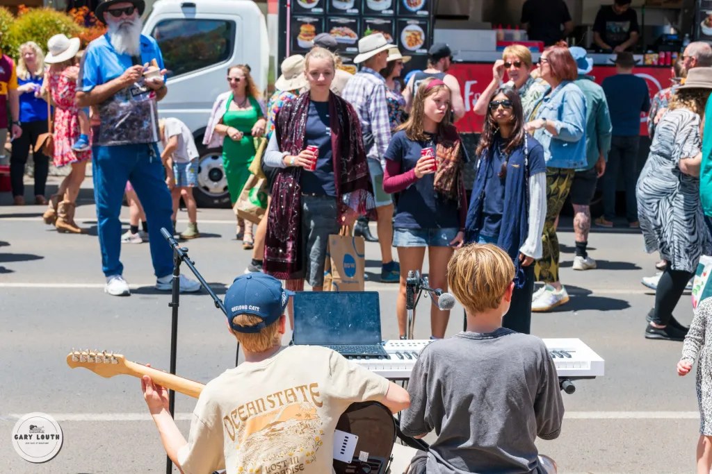 Street musicians performing for a crowd at the Blues at Bridgetown Street Party.